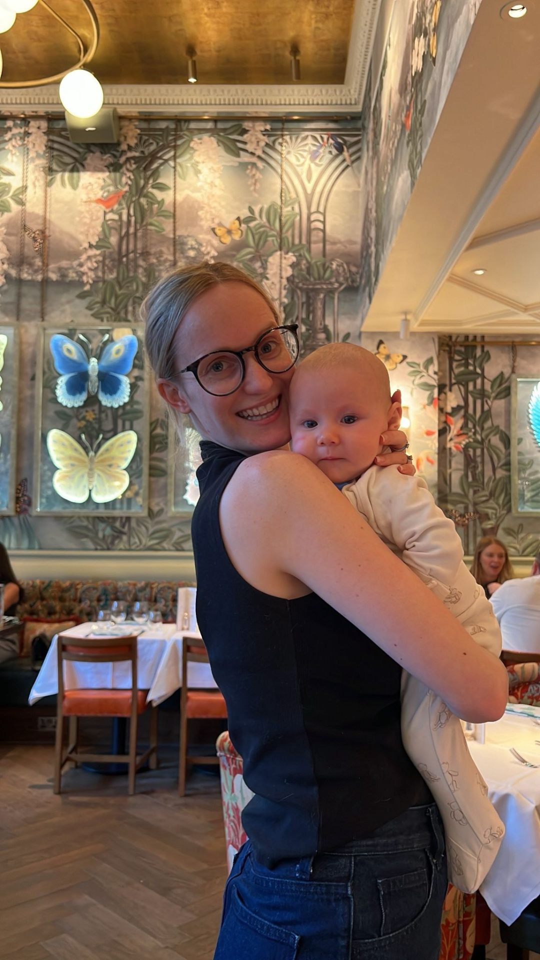 Andi holding her baby — founder of Mum's Dance Coffee & YAP
